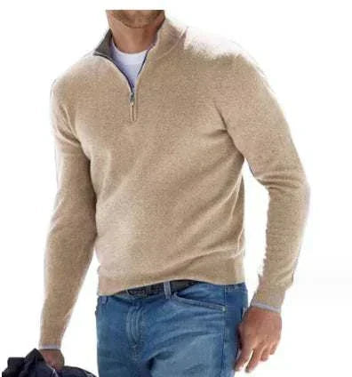 Beige quarter-zip golf jumper worn by a person on a white background