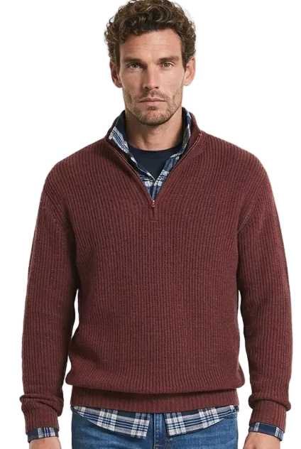 A man wearing a knitted gol jumper in red