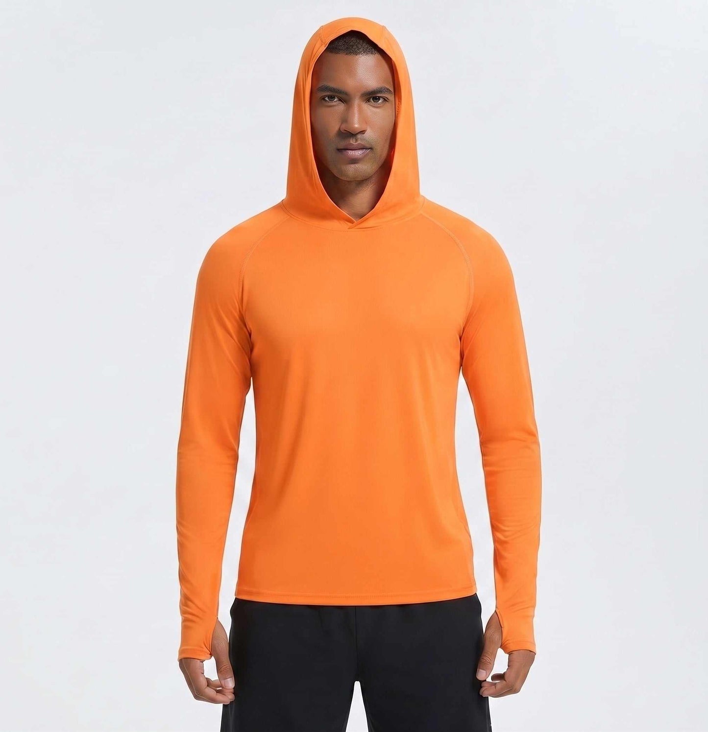 A golfer wearing an orange golf hoodie