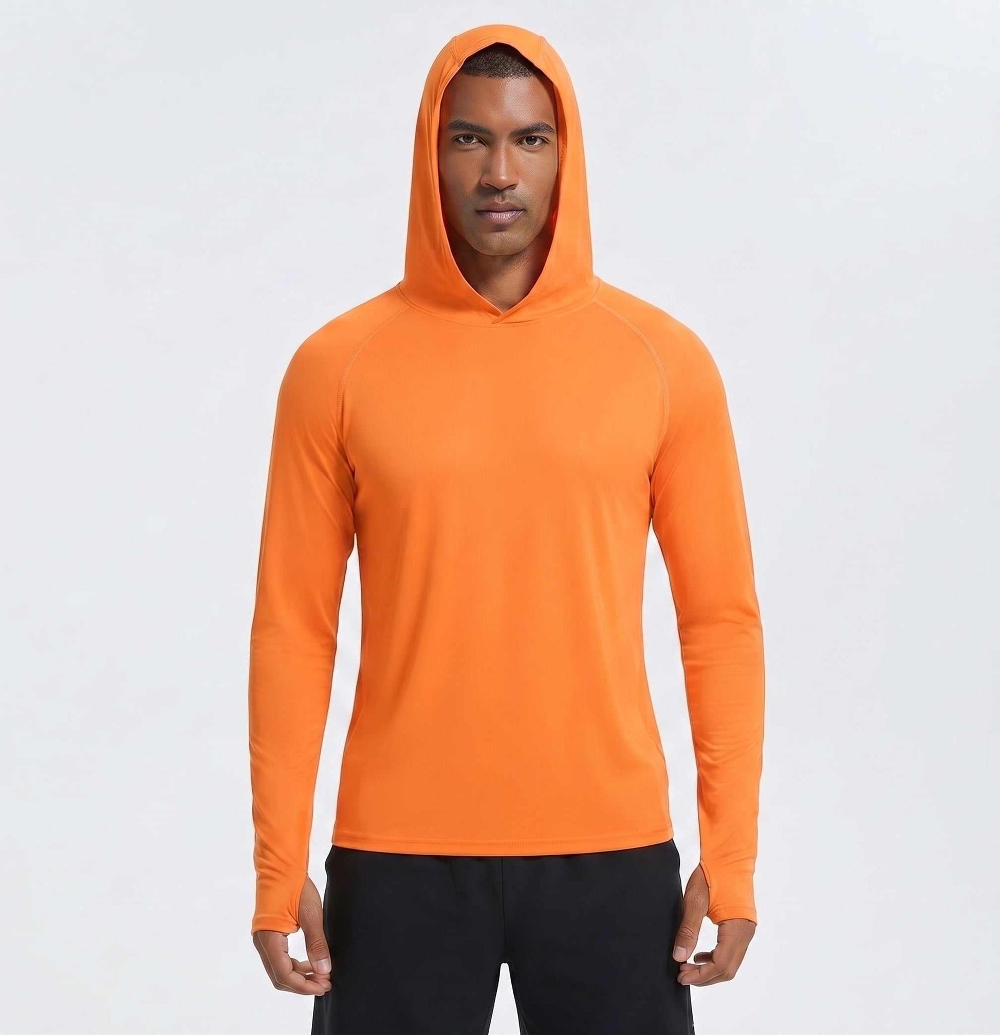 A golfer wearing an orange golf hoodie