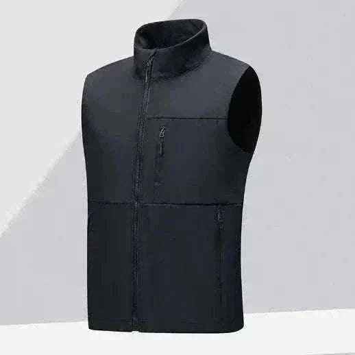 Golf gilet in dark navy soft-shell fabric, sleeveless with a high stand collar, front zip and three zip pockets