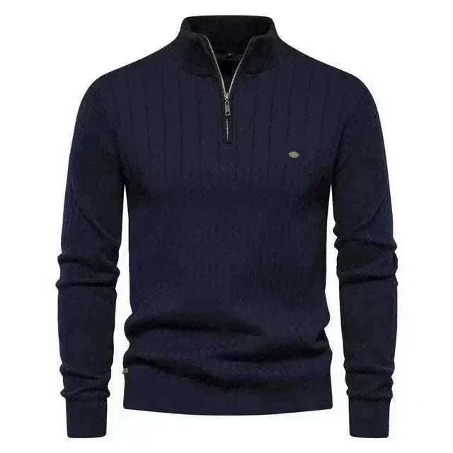 Golf jumper in navy knit cotton with a subtle textured pattern, quarter zip collar, and ribbed cuffs and hem