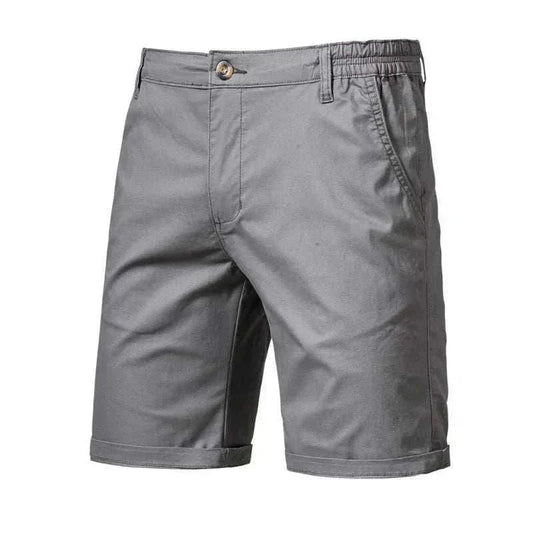Golf shorts in solid dark grey woven fabric, featuring a tailored straight-leg fit, elasticated waistband and cuffed hems