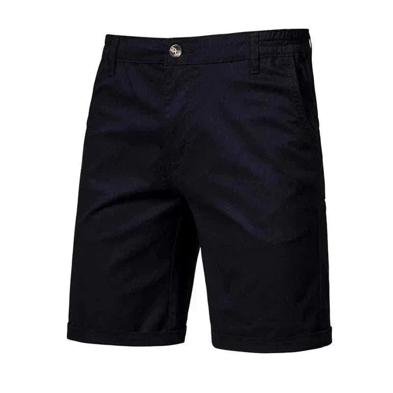 Golf shorts in a deep navy solid fabric, with a tailored straight-leg cut, belt loops, front button and cuffed hems.