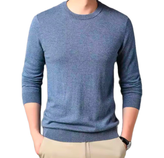Golf Sweater in muted blue knitted fabric with a classic round neckline, long sleeves and ribbed cuffs and hem