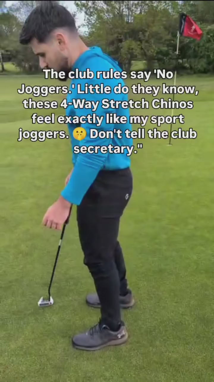 Load video: I video of a golfer squatting wearing GolfThing slim fit golf trousers